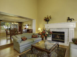 Elegant Living Room Interior with White Fireplace and Flowers